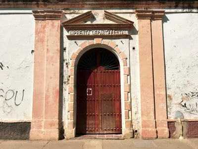 Charming colonial doorway on a sunny street in Cartagena, Colombia.