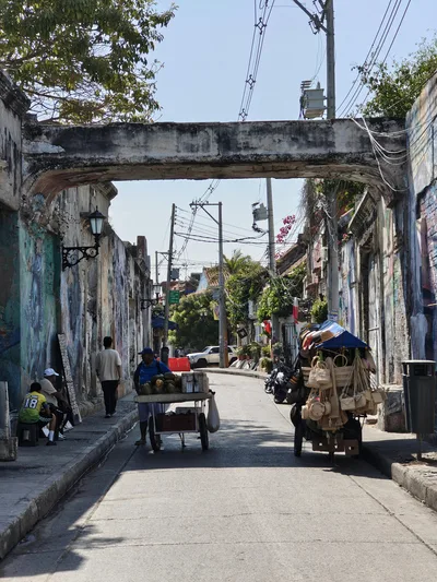 Vibrant street scene with vendors in Cartagena's historic neighborhood, capturing local culture and architecture.